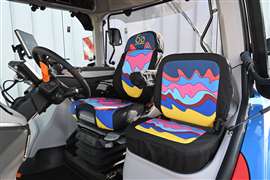 Interior of tractor carries over the 1960s-inspired colour scheme